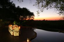 Dining at sunset at Impalila Island Lodge, Caprivi Strip, Namibia