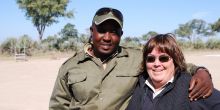 Lynn with guide in Zambia