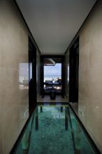The suites at Kuredu Island Resort, Lhaviyani Atoll, Maldives have unique glass floors so guests can view the stunning blue waters underneath their private suites.