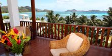 Each room has a private veranda overlooking the brilliantly turquoise waters at Hotel L Archipel, Praslin, Seychelles