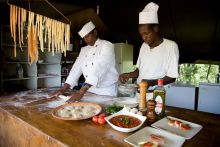 The chef team prepares fresh pasta and a sauce made from scratch at Offbeat Mara Camp, Masai Mara National Reserve, Kenya