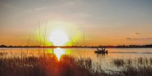 Boat sundowner at Little Kwara Camp, Okavango Delta, Botswana
