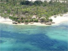 An aerial shot of the serene beach setting of Lua Cheia Beach Camp, Mafia Island, Tanzania