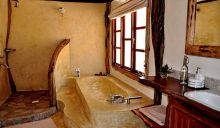 A charming and rustic bathroom at Mara House, Masai Mara National Reserve, Kenya