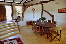 Natural wood accents bring nature into the dining area at Mara House, Masai Mara National Reserve, Kenya