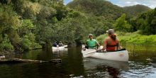 Canoeing nearby through the spectacular natural setting at Pezula Resort and Spa, Knysna, South Africa