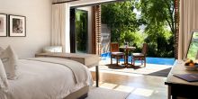 A deluxe guestroom overlooking a private plunge pool at Delaire Graff, Stellenbosch, South Africa