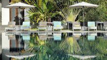 Sun loungers by the pool at Le Meridien Barbarons, Mahe, Seychelles
