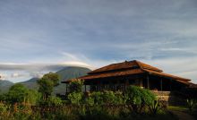 Setting with volcano in background at Virunga Lodge, Volcanoes National Park, Uganda