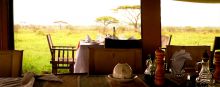 The open-air dining area looking out to the plains at Serengeti Savannah Camps, Serengeti National Park, Tanzania