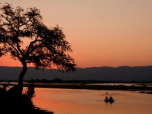 Canoeing at sunset on Mana Pool Canoe Trails, Mana Pool National Park, Zimbabwe (Wilderness Safaris)