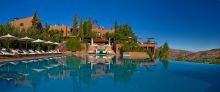 Stunning view from the main outdoor pool at Kasbah Tamadot, Atlas Mountains, Morocco