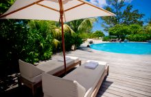 Sun loungers by the pool at Denis Island Lodge, Denis Island, Seychelles